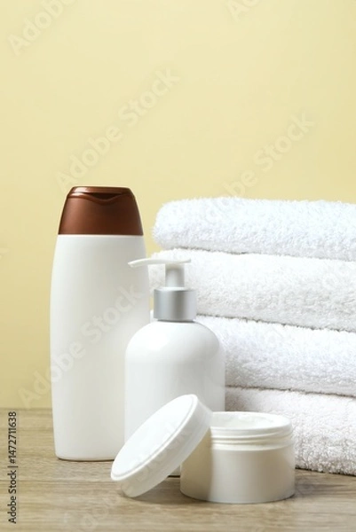 Obraz Stack of bath towels with cosmetic on the table