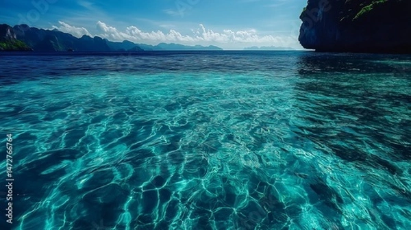 Obraz Stunning turquoise ocean water with mountain view background sea sky sun blue calm green clear beach