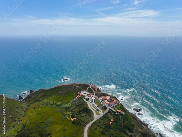 Fototapeta Lighthouse complex and Atlantic coastline seen from high above