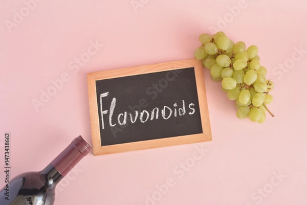 Fototapeta Biologically active compounds flavonoids are found in grapes and red wine and the label "flavonoids".