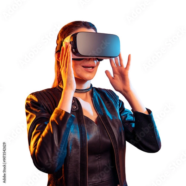 Fototapeta Stylish woman in black leather jacket wearing virtual reality headset on isolated white background making hand gesture, with colorful blue orange lighting for digital technology concept