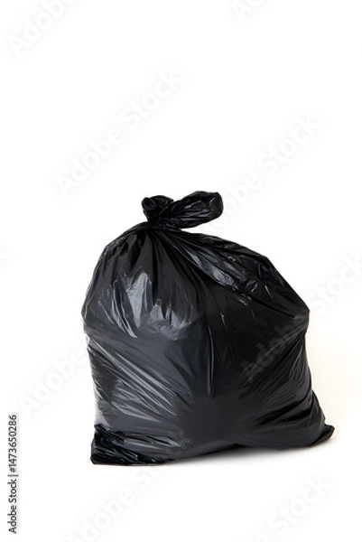 Fototapeta Black Plastic Garbage Bag isolated on white background