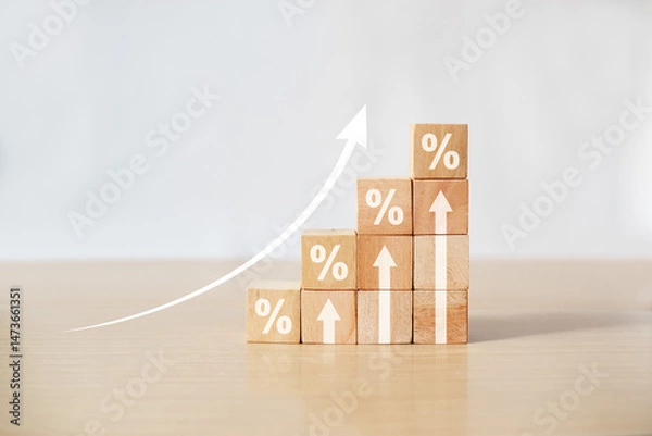 Obraz Interest rate financial and mortgage rates concept. Wooden blocks with Icon percentage symbol and arrow pointing up. company business growth and sales, interest rate, tax, real estate