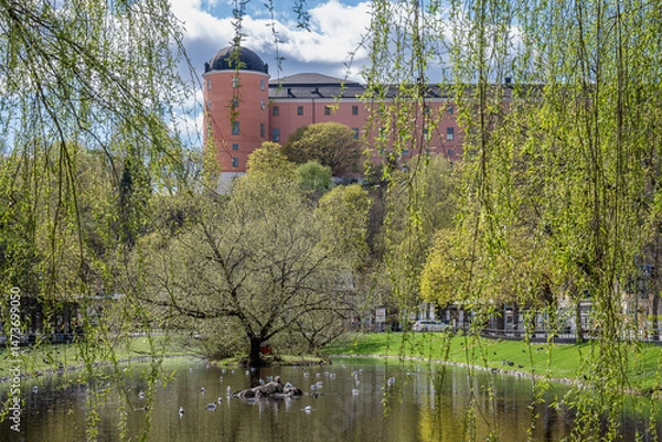 Fototapeta Uppsala Castle viewed from pond Svandammen on a sunny spring day in Sweden in late April 2025. Construction of the famous castle began in 1549 and completed in the early 17th century.