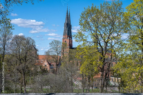 Fototapeta Uppsala Cathedral, the seat of the Archbishop of Sweden, on a sunny spring day in late April 2025. The cathedral was consecrated in 1435. 