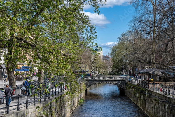 Fototapeta River Fyrisån on a sunny spring day in late April 2025. Uppsala is a famous university town in Sweden..