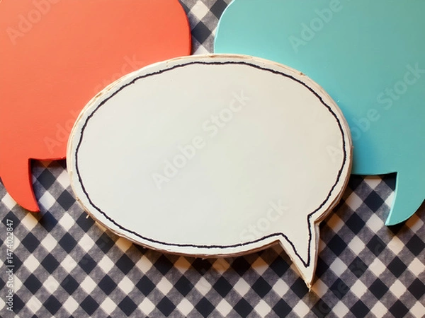 Fototapeta Vibrant Speech Bubbles on Gingham, A Colorful Dialogue of Communication, Creative Expression and Conceptual Design, ideal for messaging, and conversational visuals