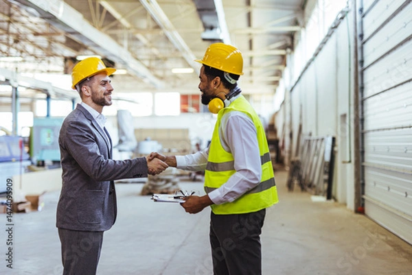 Fototapeta Business Meeting Between Engineer and Manager in Industrial Warehouse