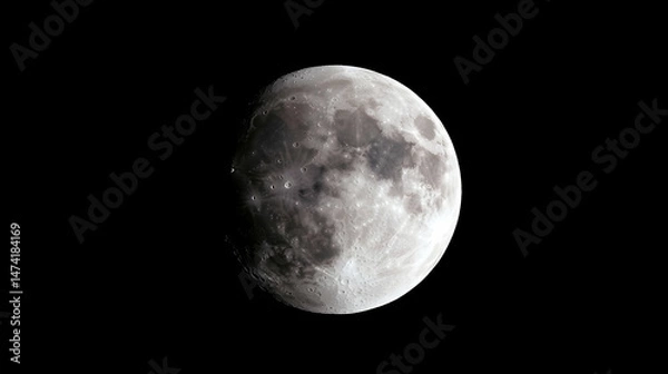 Fototapeta A partially eclipsed moon, grayscale, dark background, showing lunar surface details