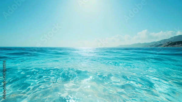 Fototapeta A beautiful landscape of the azure coastline and sea, sparkling on a sunny day, a clear, pearl-like azure sea.