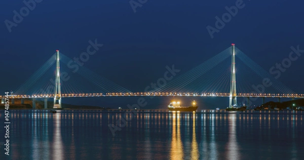 Fototapeta Night view of the bridge in the city of Vladivostok on the island of Russian