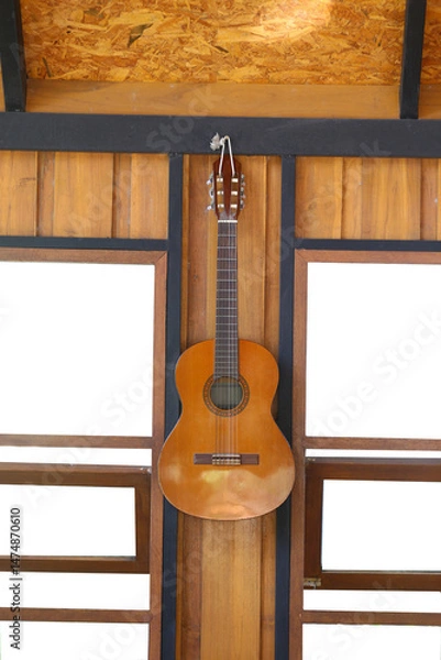 Obraz Classical Guitar hanging on the wall of the house with a blank white channel window.