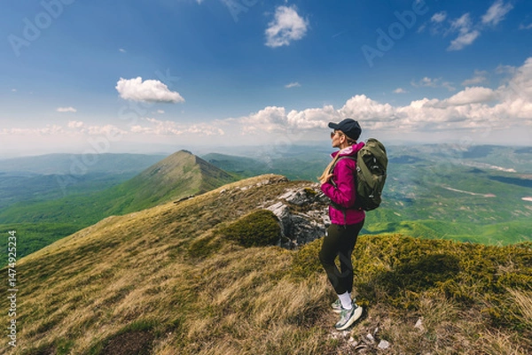 Fototapeta Young Woman with Backpack Traveling in Mountains