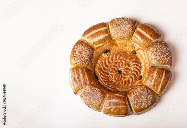 Obraz Uzbek lavash with raisins and sesame seeds isolated on white background, top view