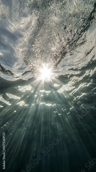 Obraz Sunlight shining through the water. The water is clear and blue. The sun is in the sky
