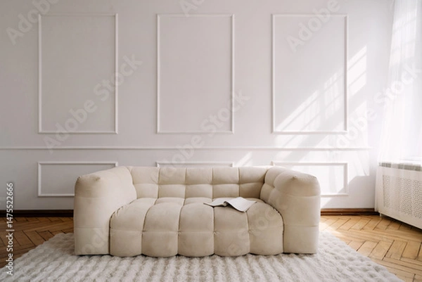 Fototapeta Modern white interior featuring a comfortable couch in a stylish apartment