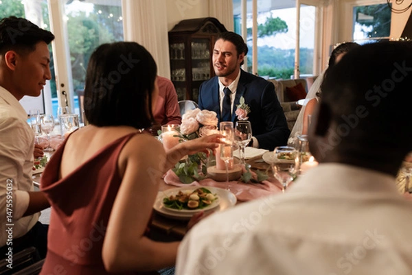 Obraz Guests enjoying dinner and conversation at elegant wedding reception table