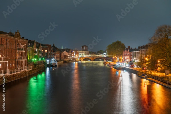 Fototapeta Skyline of city of York in England near river Ouse at dusk