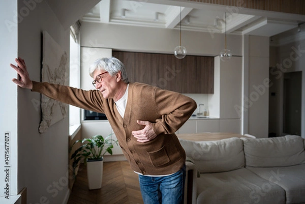 Fototapeta Afflicted senior man feel severe retrosternal pain with breathing difficulty, gripping chest. Myocardial ischemia, coronary insufficiency, radiating arm pain, autonomic symptoms, emergency pain