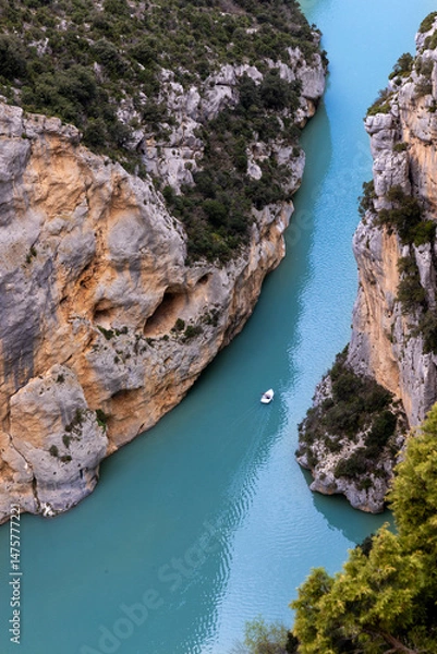 Fototapeta Boat floating through narrow turquoise canyon in Gorges du Verdon..