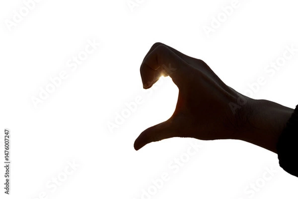 Obraz Shadow of a man's hand with a heart shape on a white background.