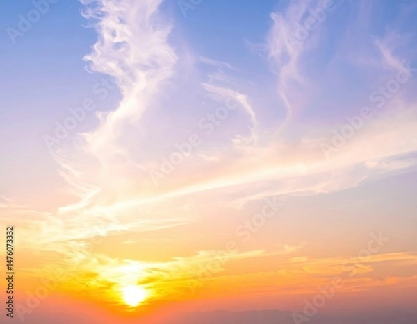 Fototapeta A vibrant blue sky stretches overhead, dotted with fluffy white clouds, creating a serene backdrop that evokes a sense of calm and tranquility.