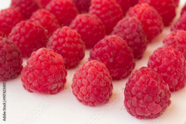 Fototapeta Raspberry on a white background close up