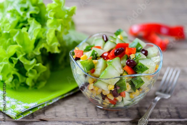 Fototapeta Vegetable salad with sweet pepper, cucumbers and haricot