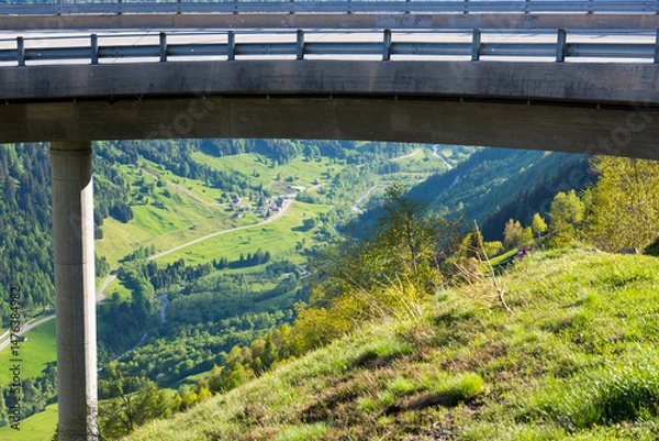 Fototapeta Mountain Road Bridge and Valley in a Sunny Summer Day in san Gottardo, Ticino, Switzerland.