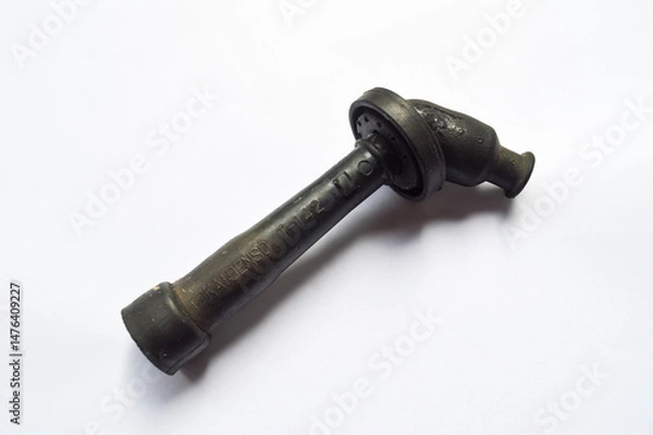 Obraz A black colored spark plug shell isolated on a white background