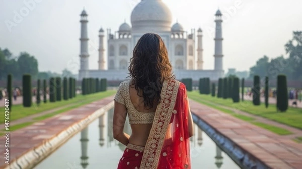 Fototapeta Woman in Red Sari Facing Taj Mahal--.png