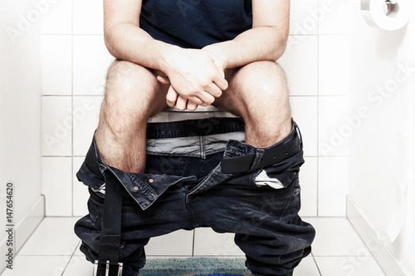 Obraz Man sitting on the toilet