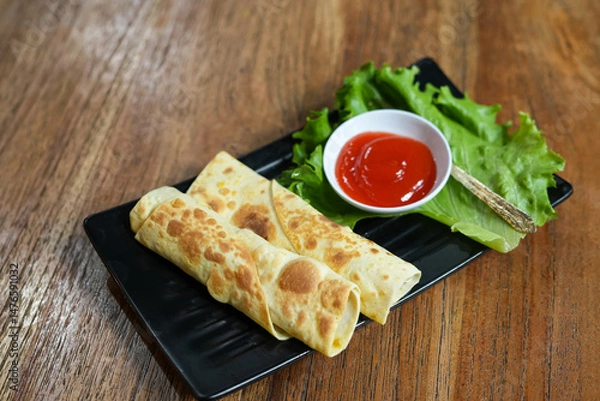 Fototapeta Delicious kebab serving with sauce
