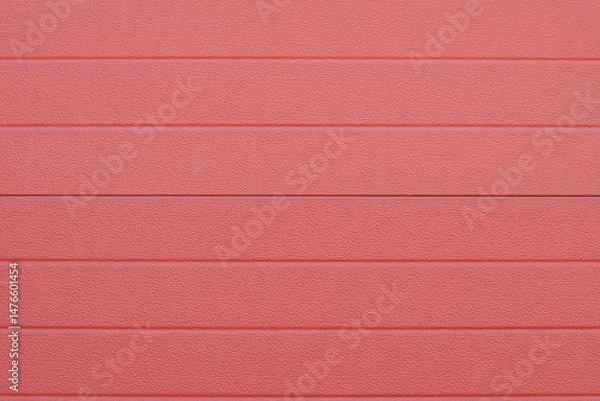 Obraz Close up of red corrugated metal sheet creating repeating textured pattern, garage door detail, durable and corrosion resistant cladding material,