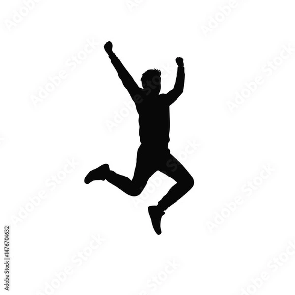 Fototapeta Silhouette of a man celebrating a victory with arms raised and jumping in excitement