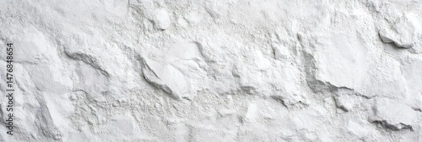 Fototapeta Pile of light-colored granular material, textured like a rough stone surface.  A close-up view shows the uneven, mountainous topography of the powder
