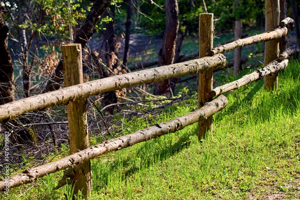 Fototapeta  rural fence consisting of crossbars attached to vertical posts