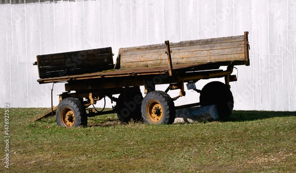 Obraz An old, broken trailer on a farm on wheels.