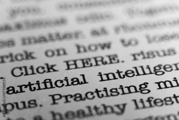 Fototapeta Artificial intelligence. Text printed on a page. A piece of paper with a phrase written in retro typewriter font