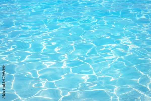 Fototapeta Abstract blue colored water with ripples on the surface. Turquoise water with shining texture background. Top​ view​ of blue​ water.​