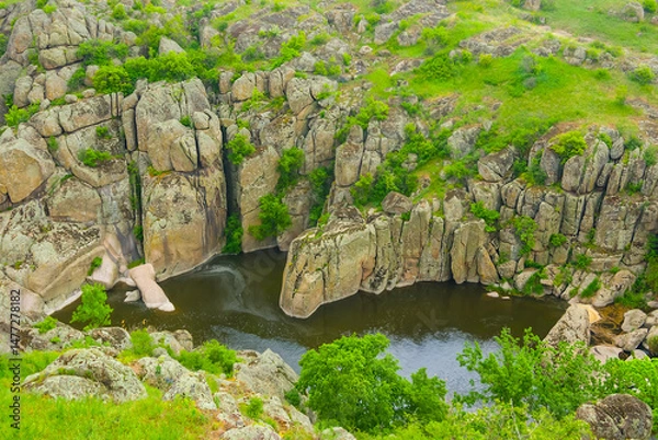 Fototapeta calm river flow through the mountain canyon