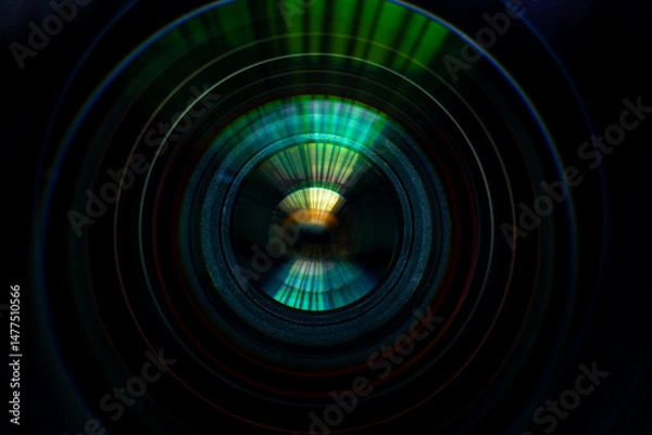 Fototapeta Close-up macro lens,Photo or video camera lens with light reflections close-up on the black background.