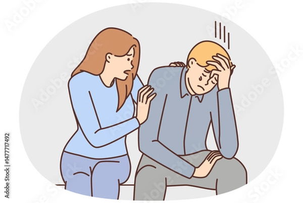 Fototapeta Caring girl comforts crying boyfriend who is upset about failure in career