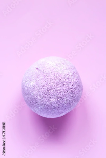 Fototapeta Aromatic purple bath bomb for home spa and relaxation.