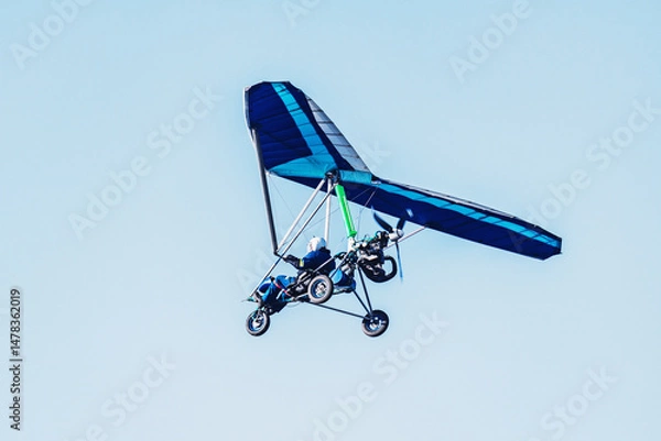 Obraz Hang glider flying in the sky.