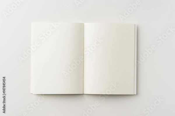 Fototapeta Business concept - Top view of blank notebook on white background desk for mockup