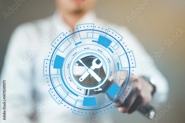 Fototapeta A man in a white suit holding a wrench, ready to fix anything.
