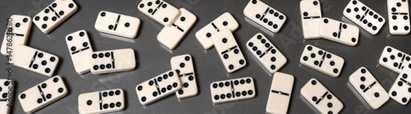 Fototapeta domino pieces on the table in full screen panorama format
