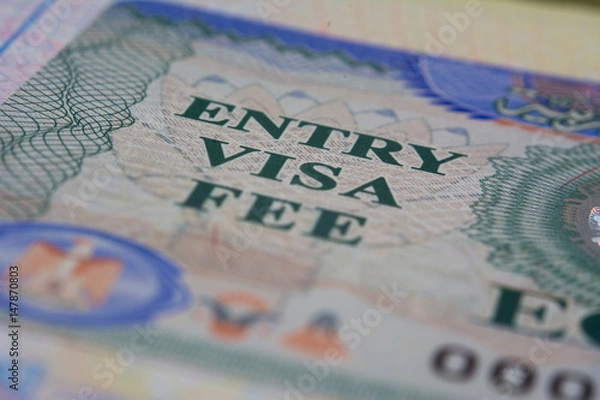 Obraz Entry visa fee stamp in passport close-up