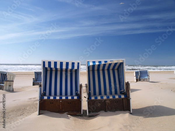 Obraz beach chairs on a deserted sunny beach